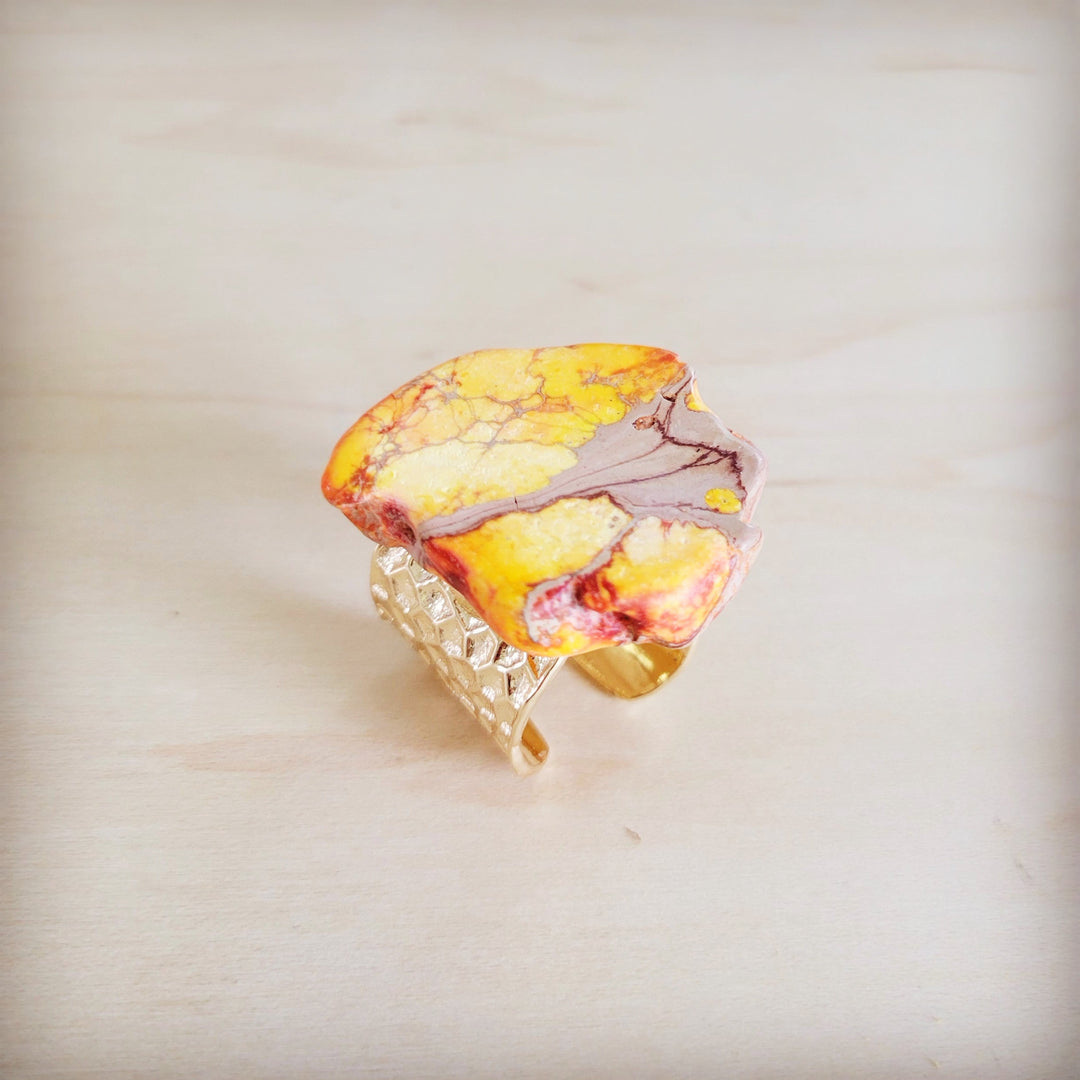 Orange-yellow marbled resin statement ring with gold-tone open band