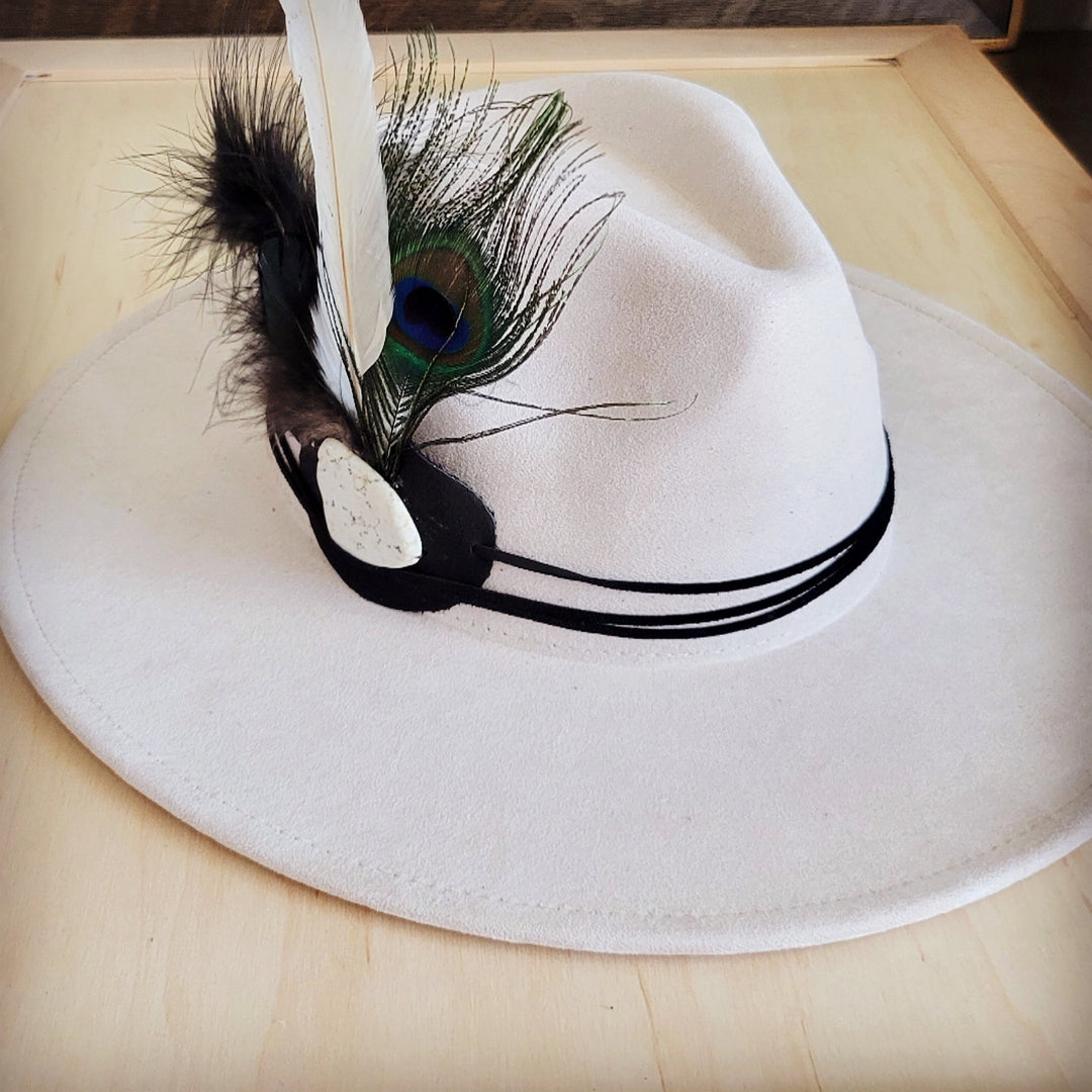 Peacock feather leather hat band with turquoise peacock eye and black striped edging