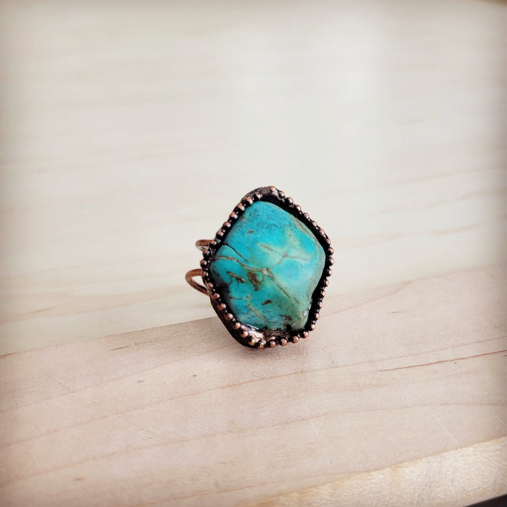 Teardrop turquoise cabochon ring in antique copper with small side prongs
