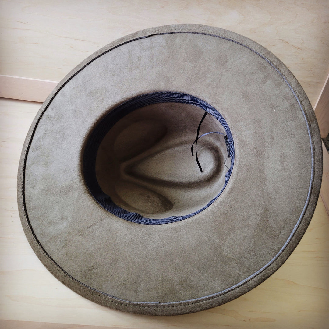 Olive felt cowgirl hat, top view with stitched brim and dark inner band