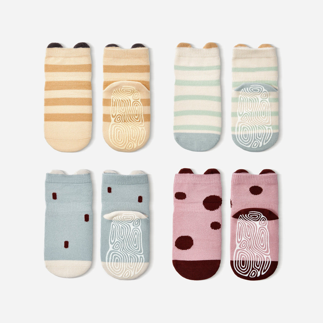 Baby non-slip socks set with striped, dot, and ladybug-graphic designs in light colors