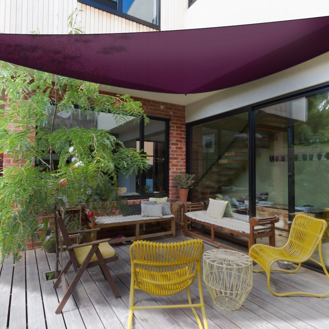 Purple triangle shade sail canopy overhead near patio seating