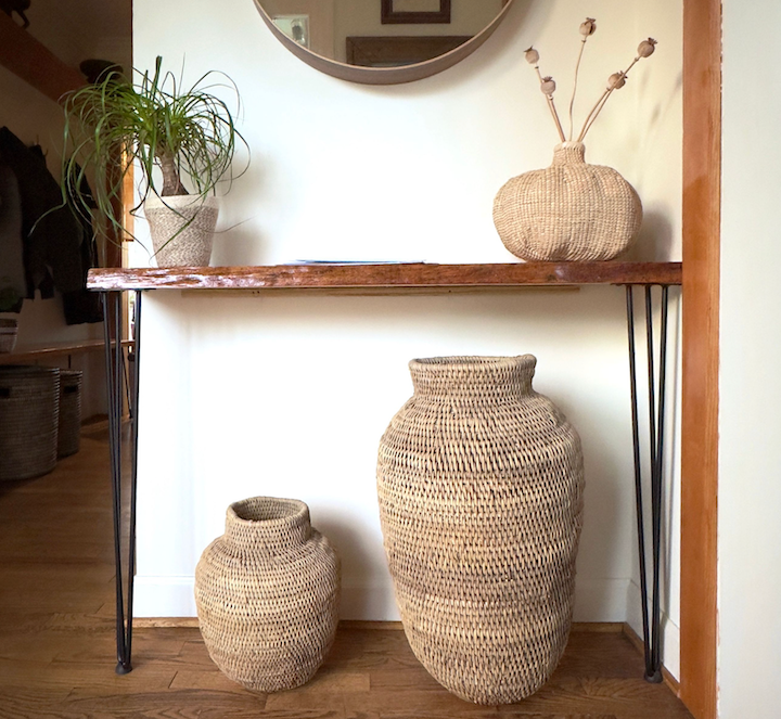 XXLarge Buhera baskets on shelf, woven straw round bodies with narrow openings