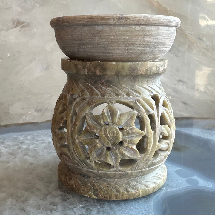 Carved soapstone essential oil burner with flower-like relief center