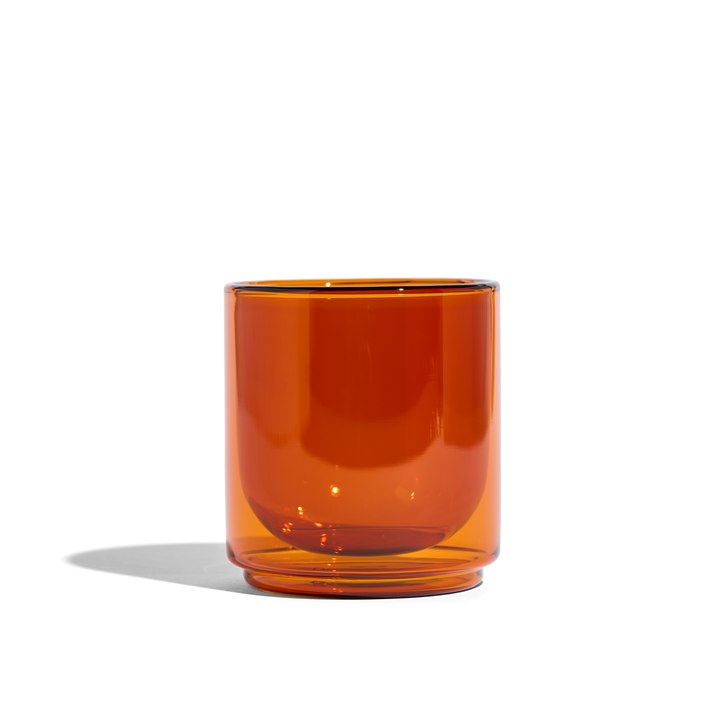 Amber glass tumbler, thick bottom and rounded cup shape