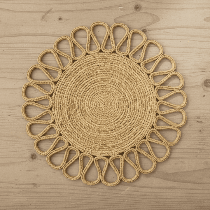 Handwoven iraca placemat with natural woven center and brown looped trim