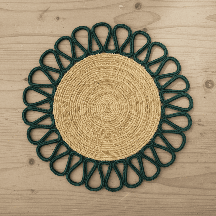 Round handwoven iraca placemat with yellow loop trim and tan woven center