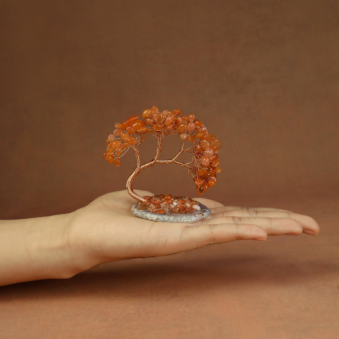 Orange beaded crystal tree ornament with copper wire branches and stone base