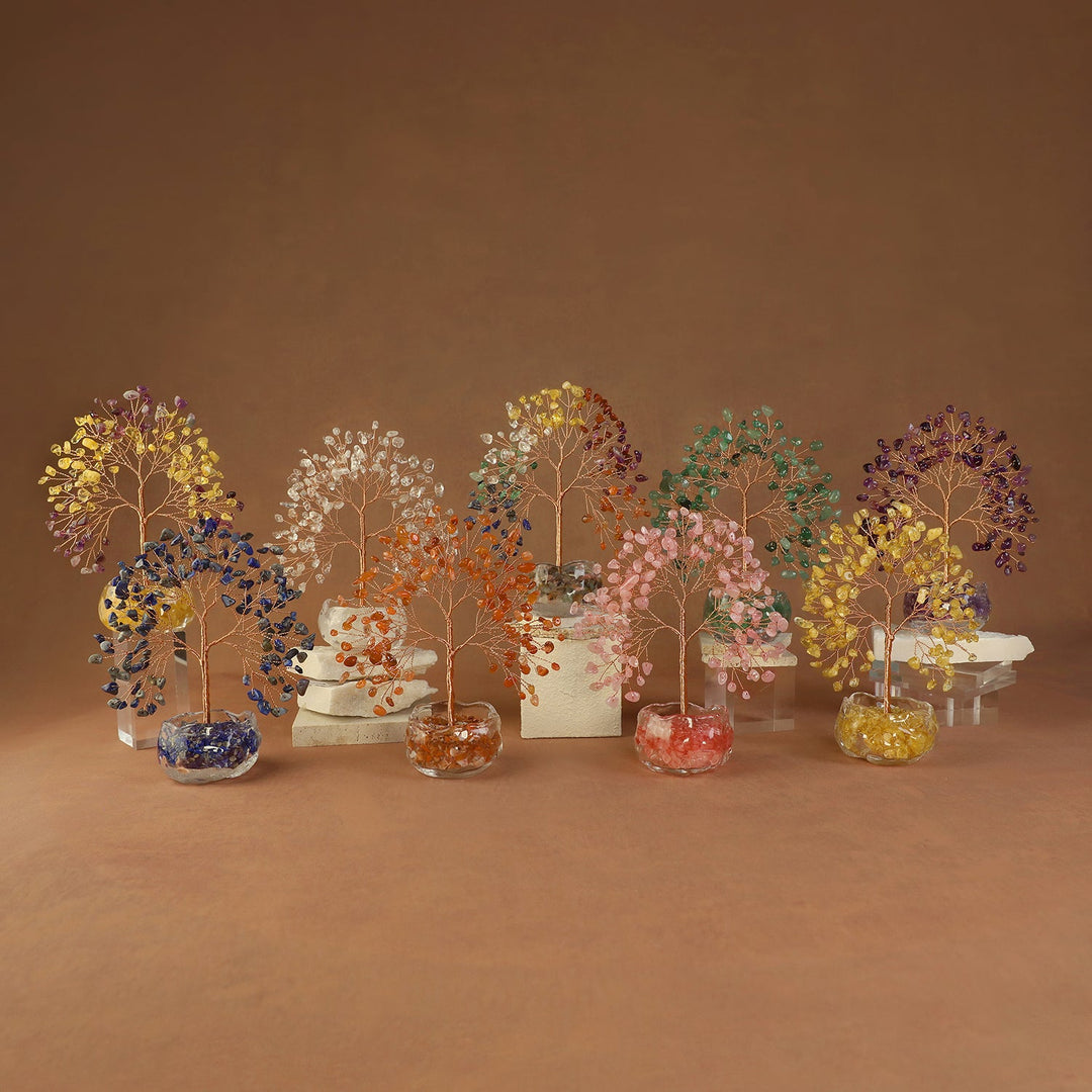 Colorful crystal tree ornaments with gemstone leaves on clear round bases