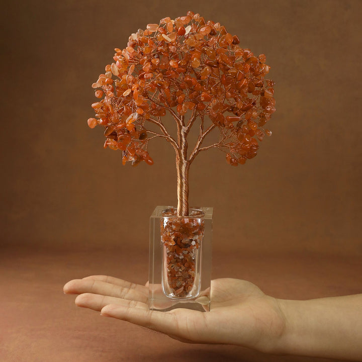 Orange crystal tree with faceted stone branches and a clear cube base