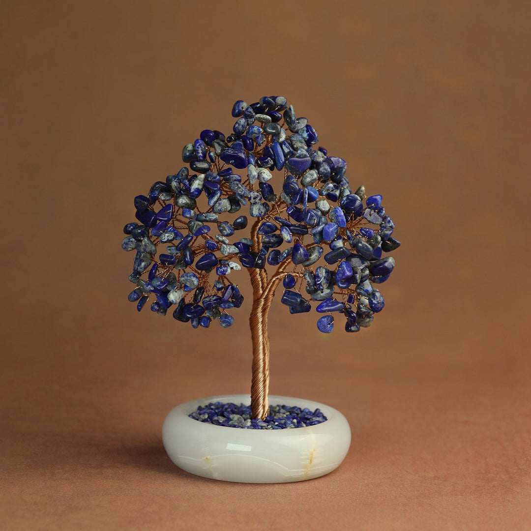 Blue lapis crystal tree with gold-toned wire trunk and round white base