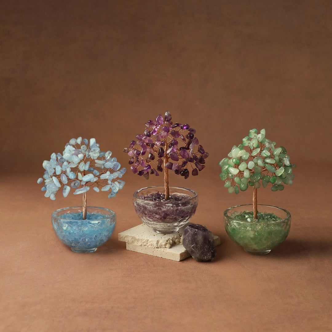 Crystal gemstone tree with blue, purple, and green beaded canopies in tinted resin pots
