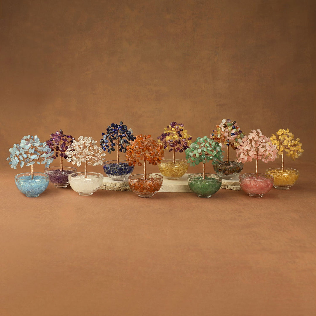 Assorted crystal gemstone trees with beaded branches in clear pots, multicolor display