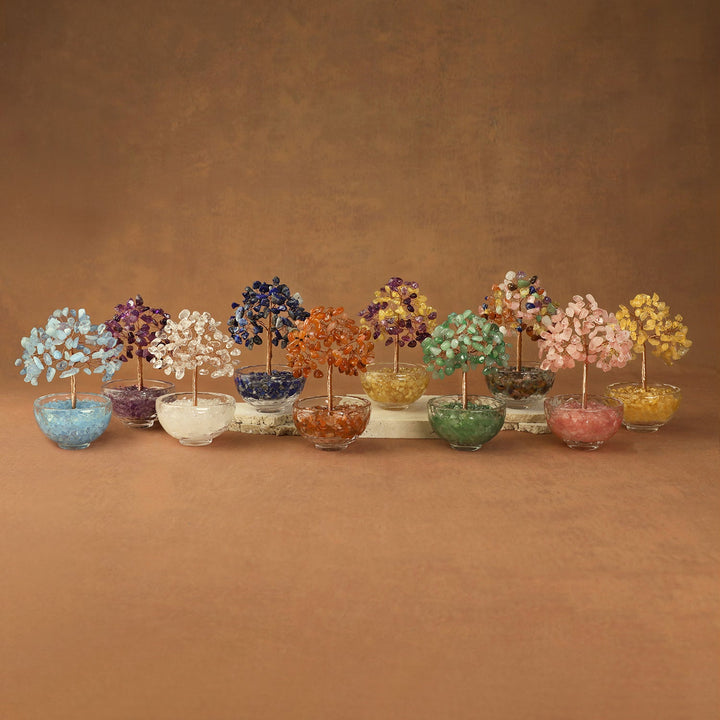 Assorted crystal gemstone trees with beaded branches in clear pots, multicolor display