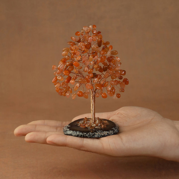Orange crystal tree sculpture with wire trunk and orange gem chip canopy on dark round base