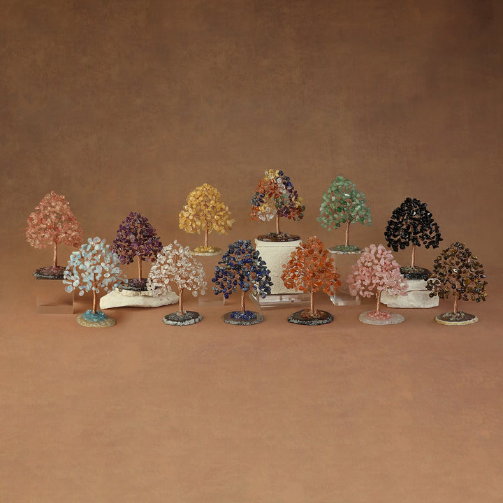 Multicolor crystal bead tree with leafy branches on a stone base