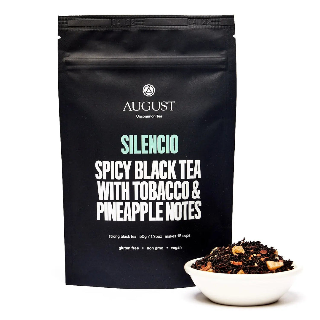 Black tea pouch with bold text: Silencio Spicy Black Tea &amp; pineapple notes