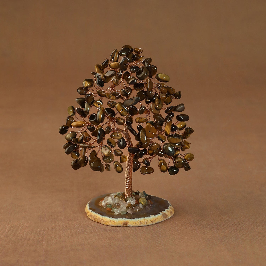 Rooted crystal tree with golden-brown tiger’s eye chips on a round stone base