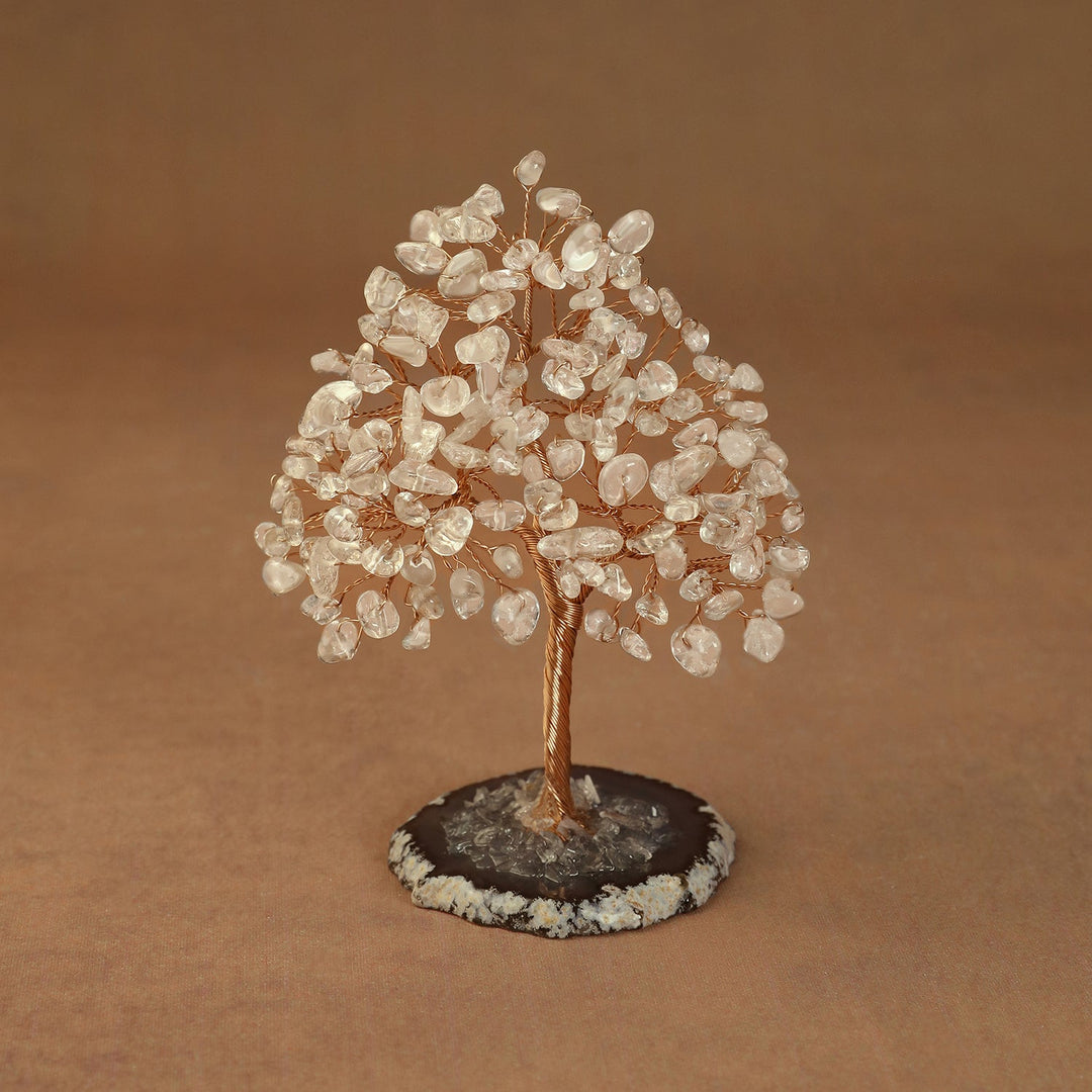 Rooted crystal tree with clear quartz chips on a round stone base