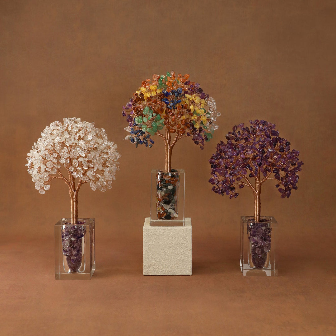 Three crystal tree ornaments with bead canopies in clear cubes and stone bases