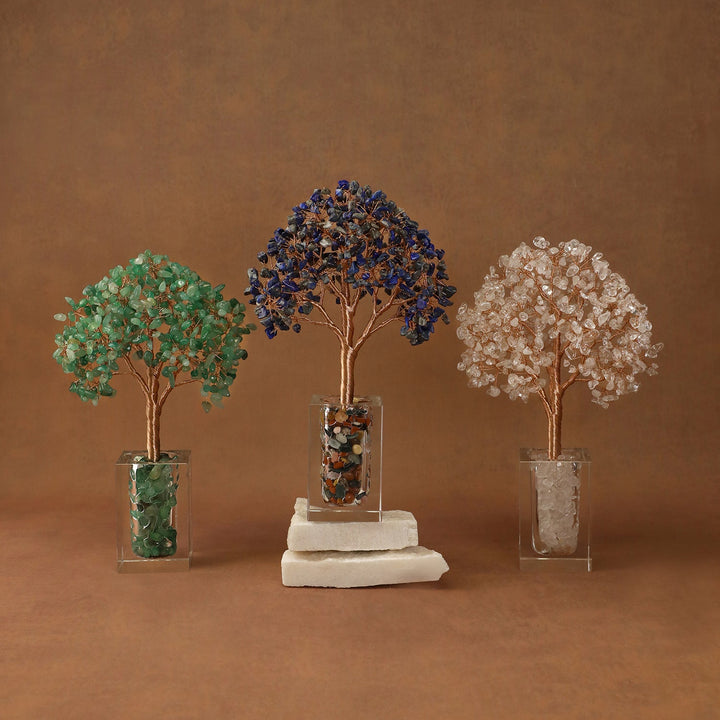 Three crystal tree ornaments with green, navy, and light gold bead canopies