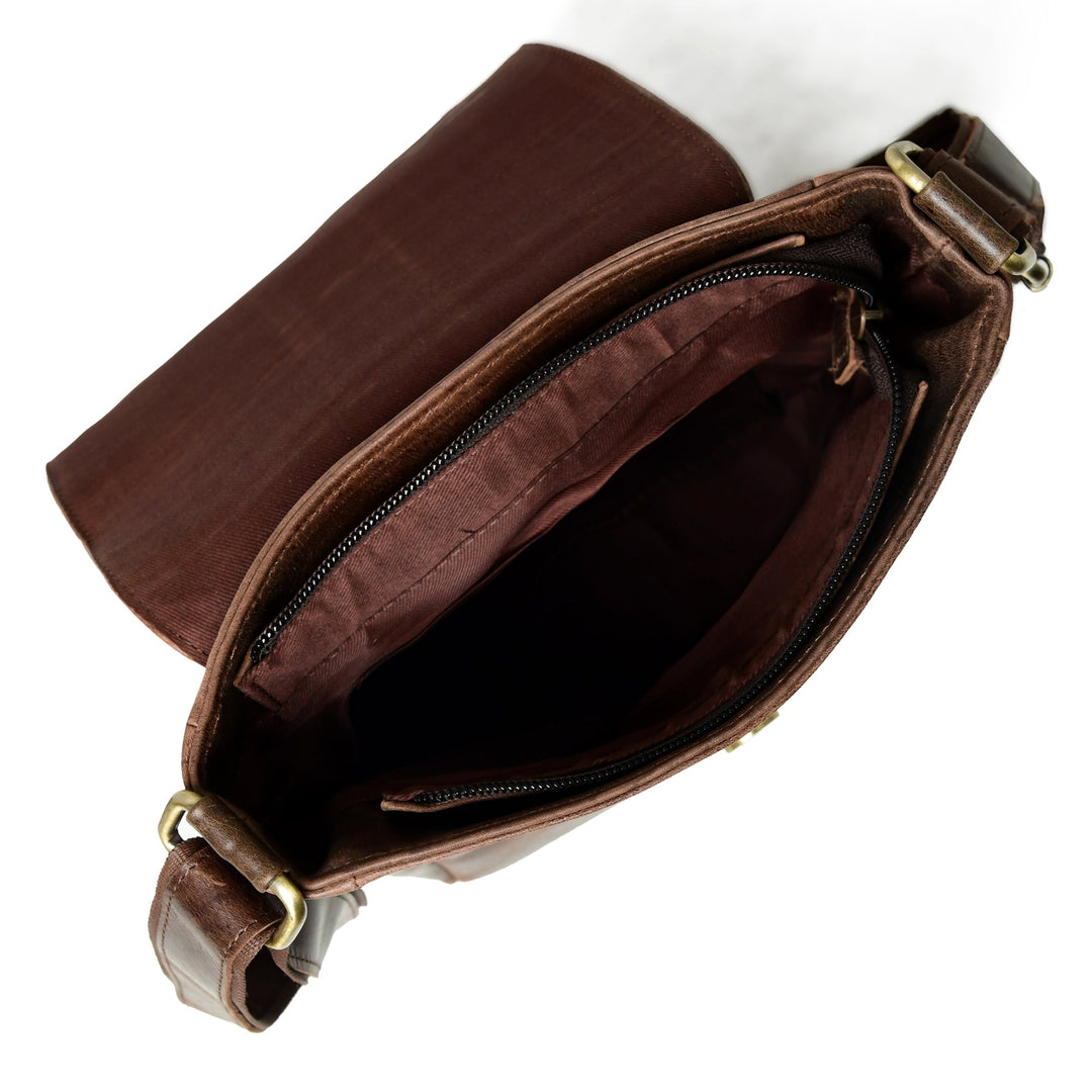 Brown leather messenger bag interior view with zip pocket and fabric lining