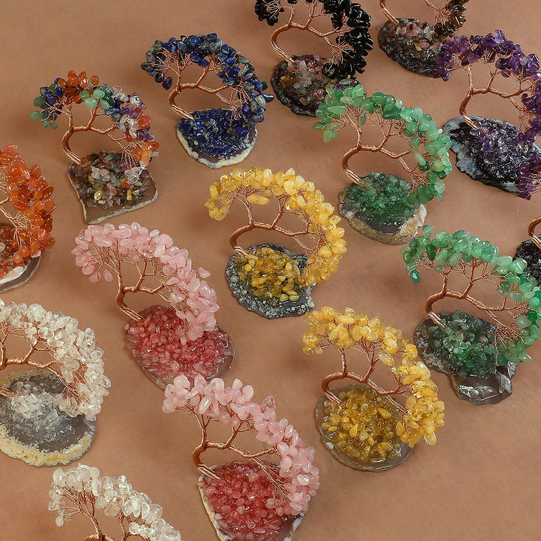 Assorted crystal tree ornaments with colorful beaded branches and copper trunks.
