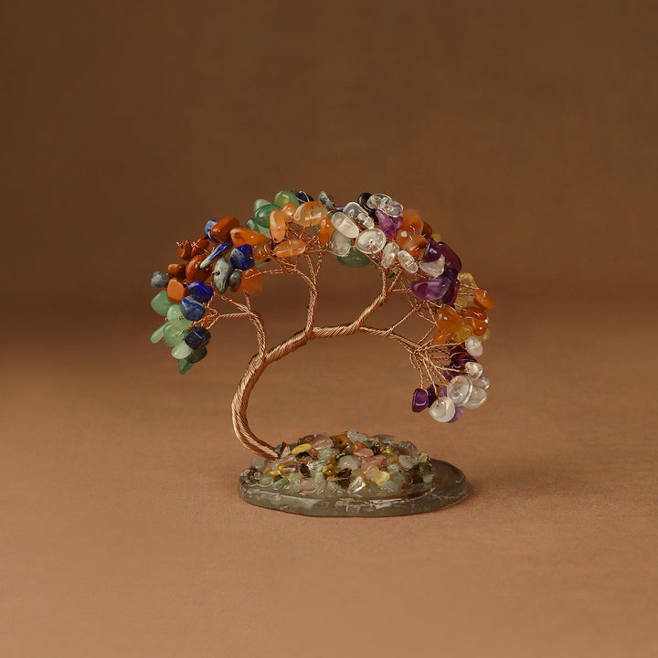 Rainbow crystal tree with gemstone beads and wire branches on a round stone base
