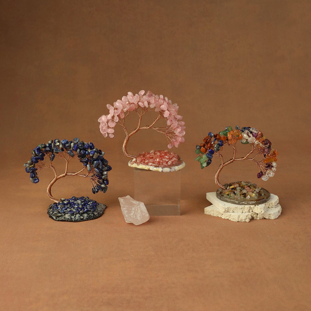 Assorted beaded crystal tree ornaments in blue, pink, and multicolor