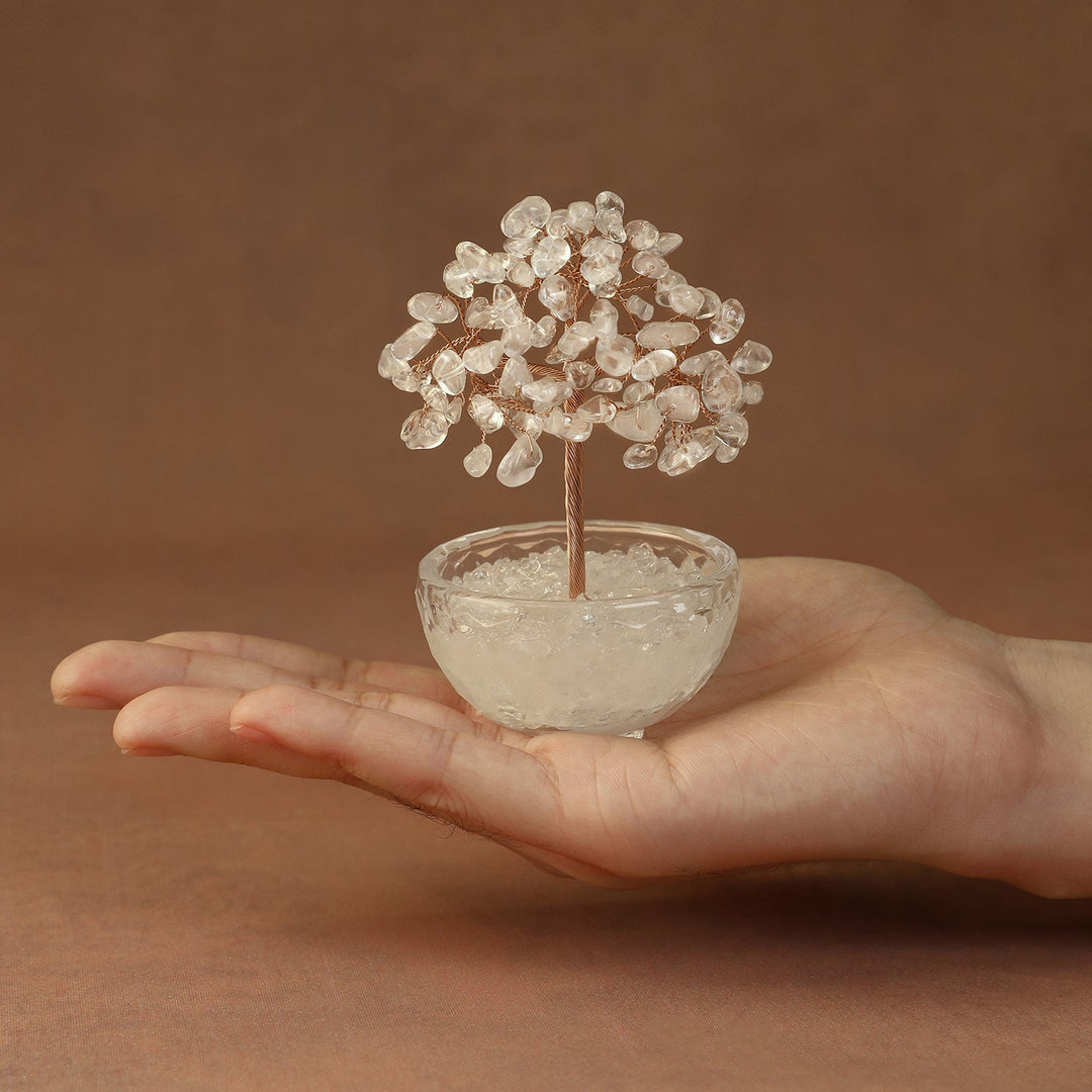White crystal tree ornament with sparkling gem branches in clear glass bowl