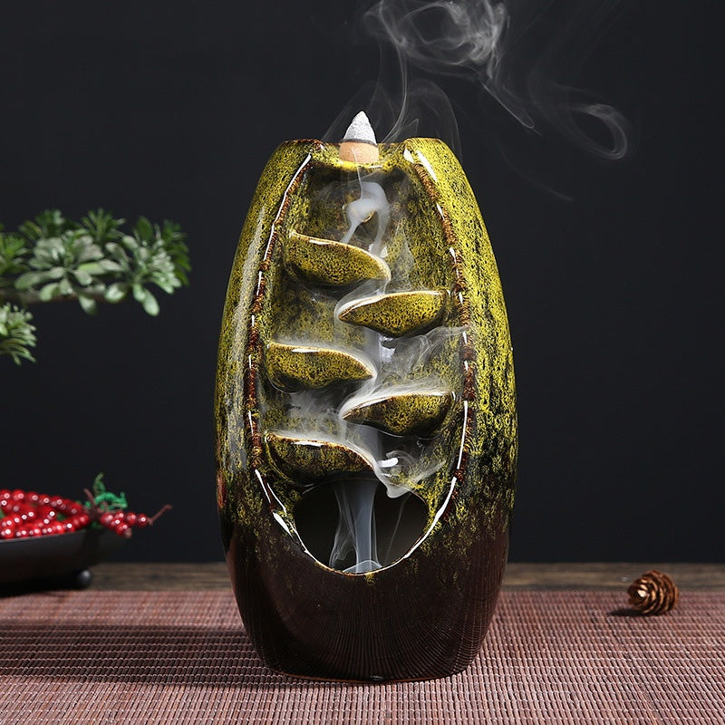 Gold-speckled multi-layer ceramic backflow incense burner with a standing cone and smoke