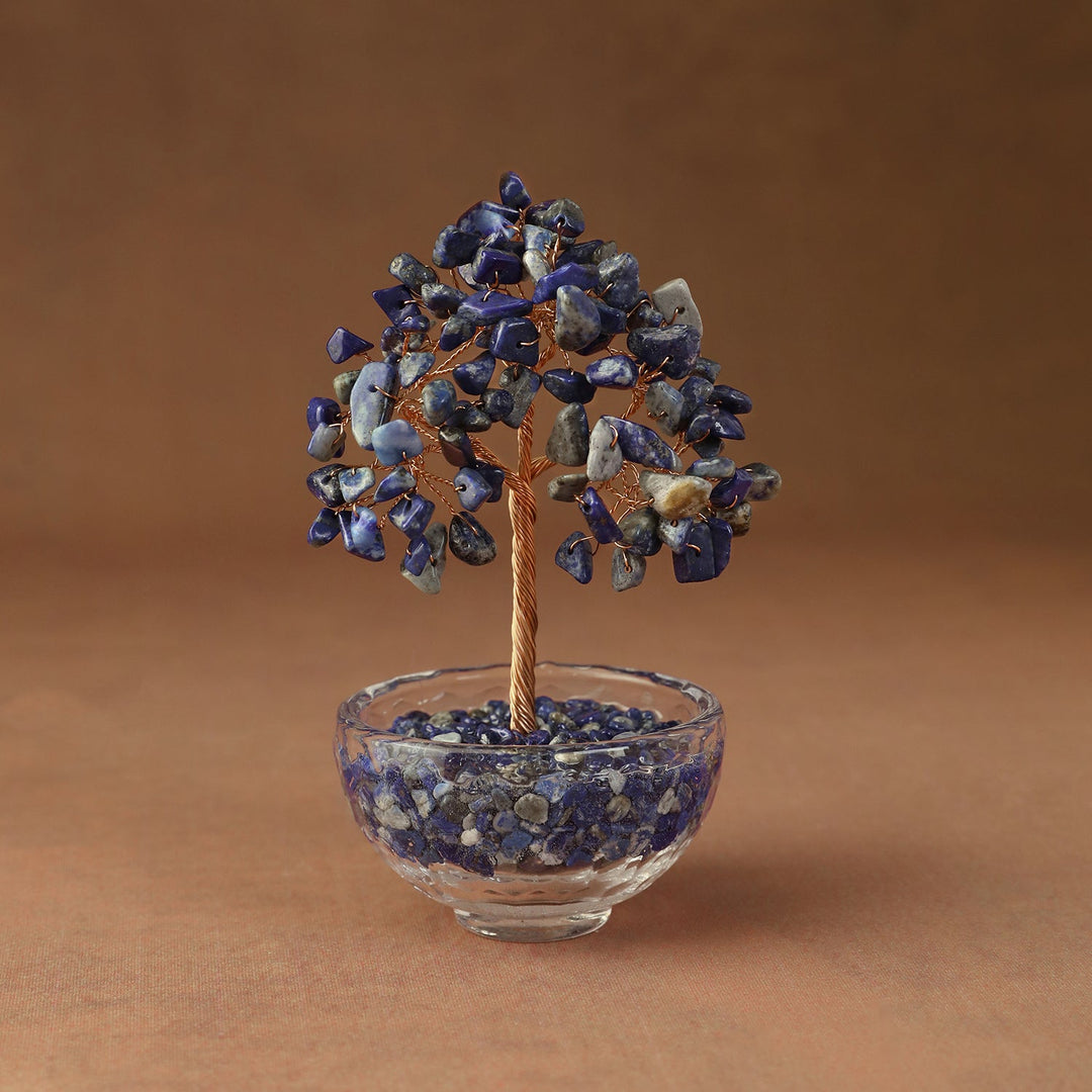 Blue crystal tree ornament with beaded branches in a clear glass bowl