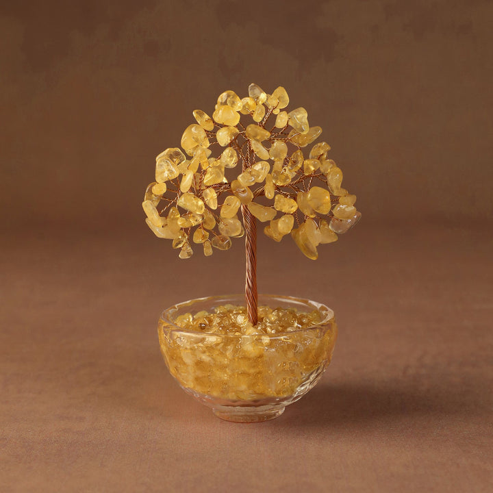 Yellow crystal tree ornament with bead branches in a clear glass bowl