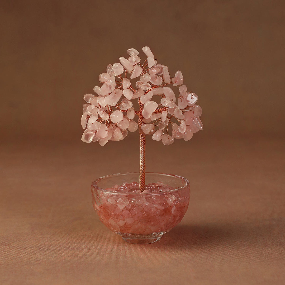Pink crystal tree ornament with bead branches in a clear glass bowl