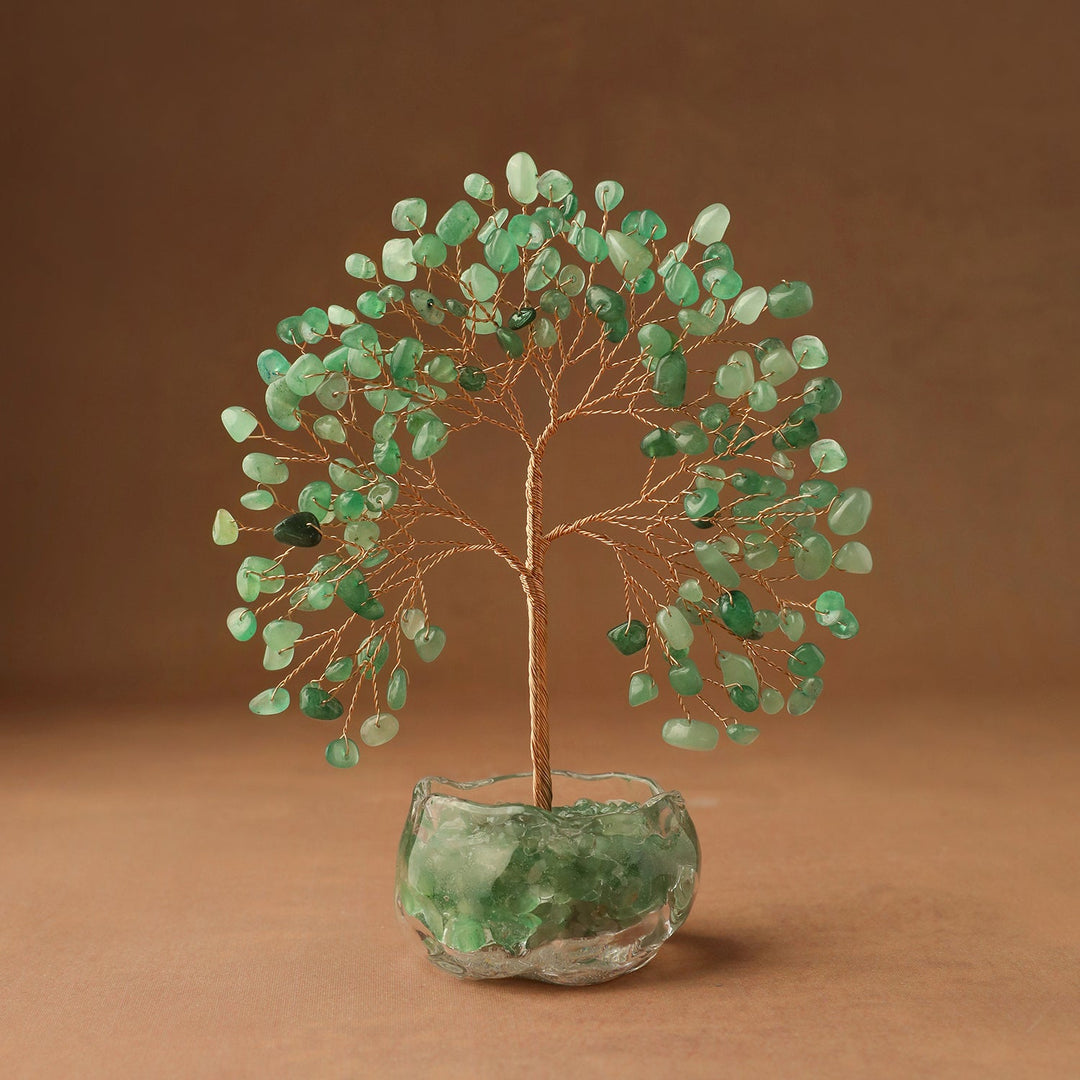 Crystal tree decor with green gem leaves and wire trunk in clear glass base