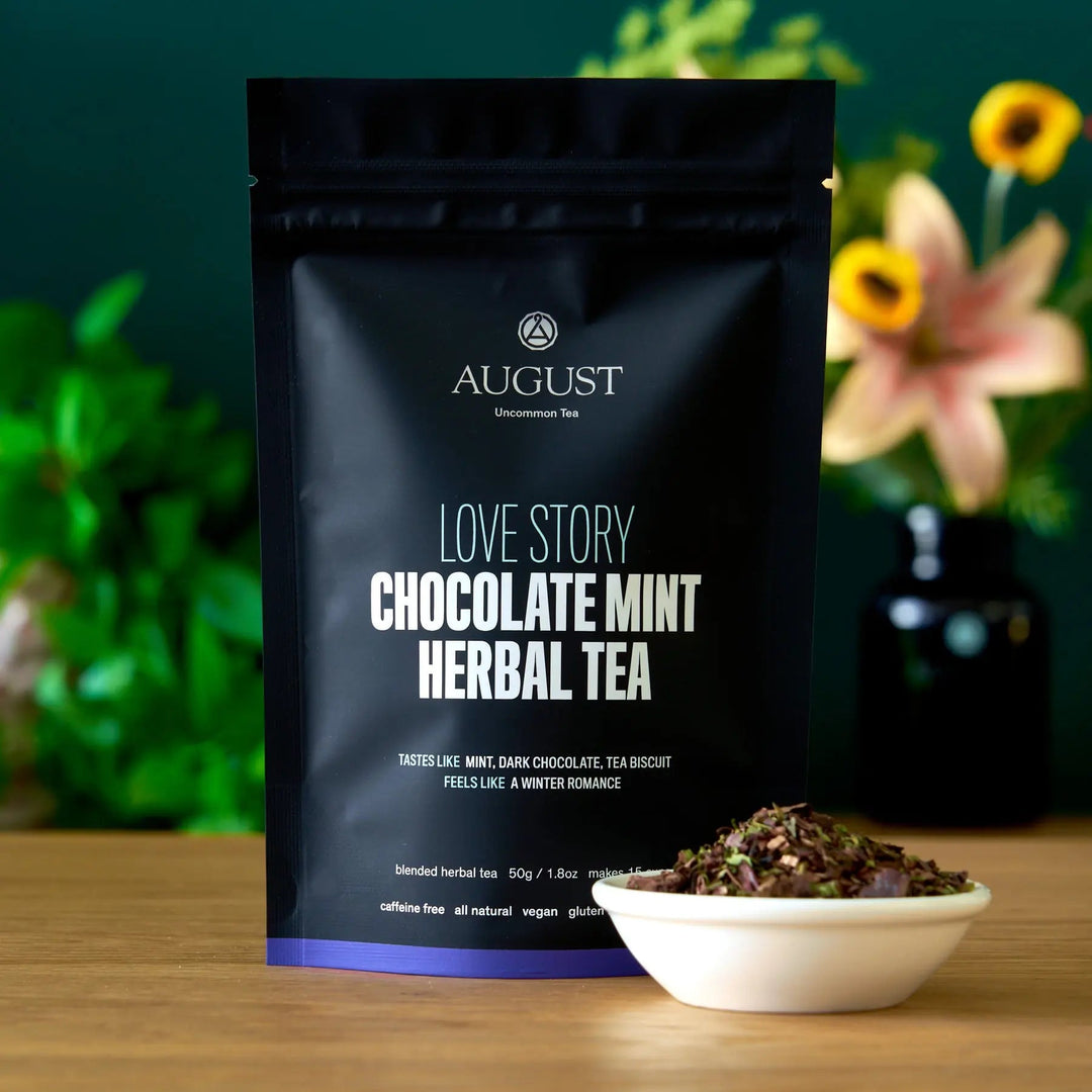 Black Love Story Chocolate Mint herbal tea pouch with front label and small bowl of leaves