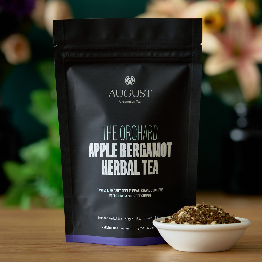 Black herbal tea pouch with label for Apple Bergamot