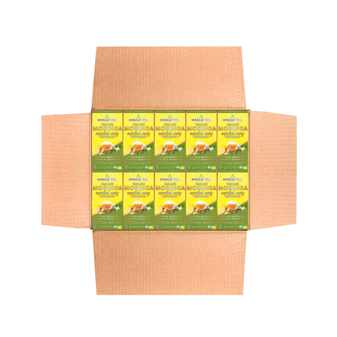 Cardboard tea box displaying multiple Miracle Tree organic moringa ginger & lemon sachets