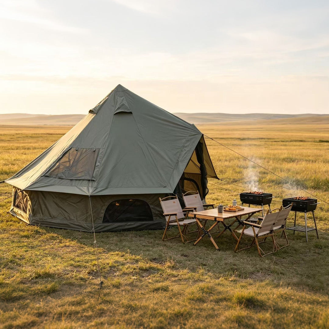 Bell tent with stove setup outside, dark mesh windows and open front