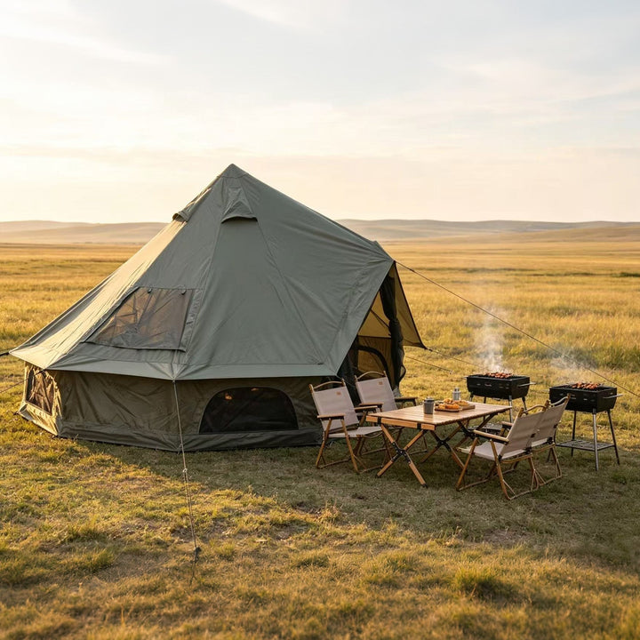 Bell tent with stove setup outside, dark mesh windows and open front