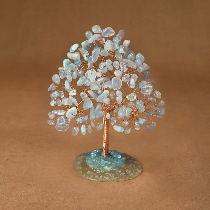 Light blue opalescent crystal tree sculpture with wire trunk and gemstone chip canopy on base
