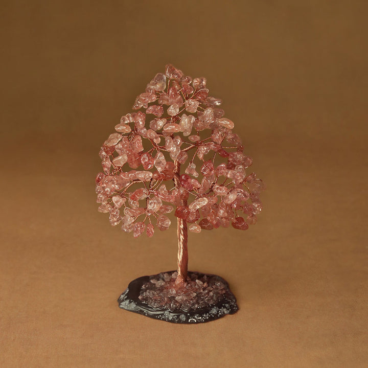 Rose quartz pink crystal tree sculpture with wire trunk and gemstone chip canopy on base