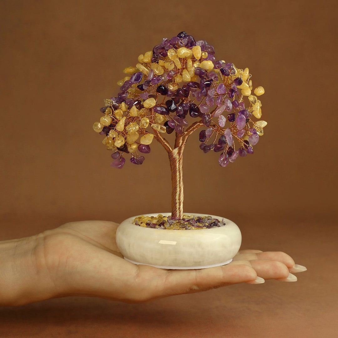 Amethyst and yellow crystal gemstone tree on white round jade-style base