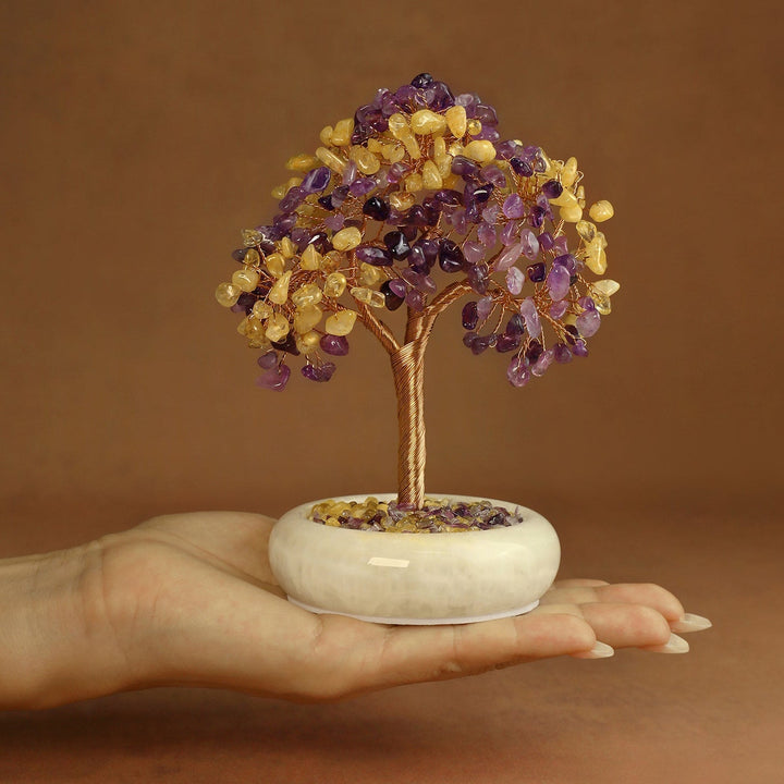 Amethyst and yellow crystal gemstone tree on white round jade-style base