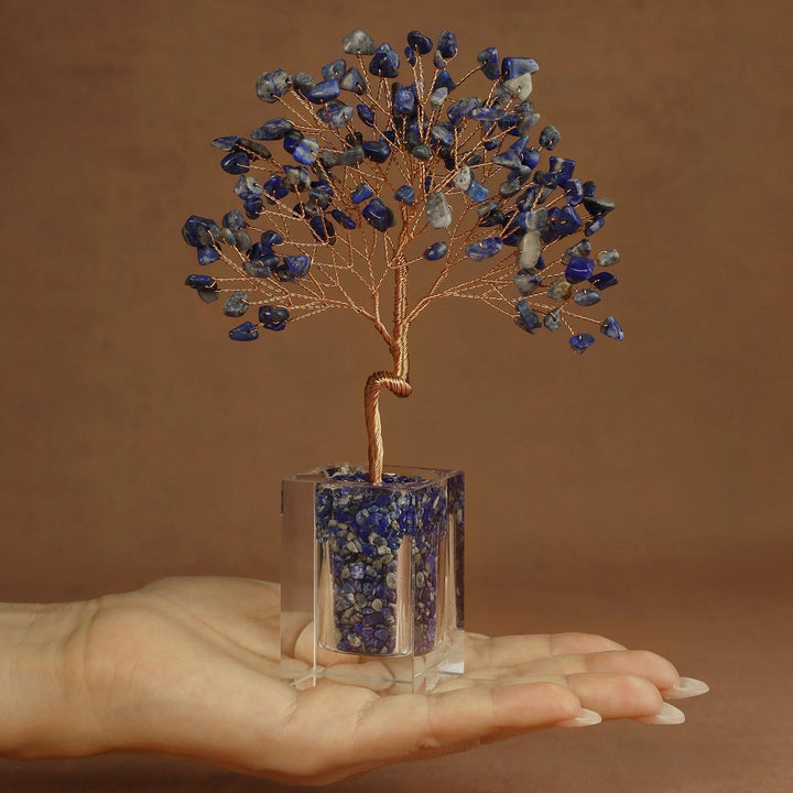 Dark blue crystal tree ornament with wire branches and lapis-style stones in a clear cube base