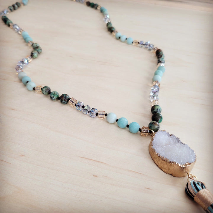 Long beaded necklace with white druzy teardrop pendant and blue stone beads