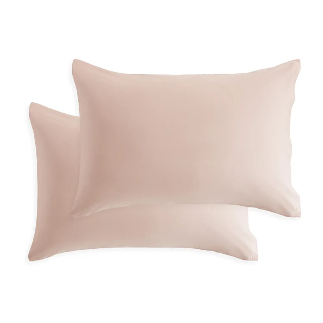 Cotton jersey pillowcase set in blush pink, with two matching rectangular pillows
