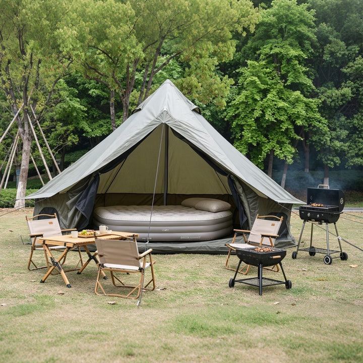 Dark green bell tent with open front, air mattress inside, and stove jack area