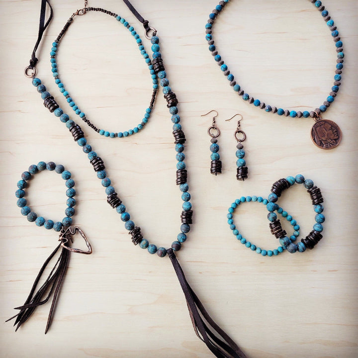 Turquoise beaded earrings with dark wood accents and dangling round bead dangles