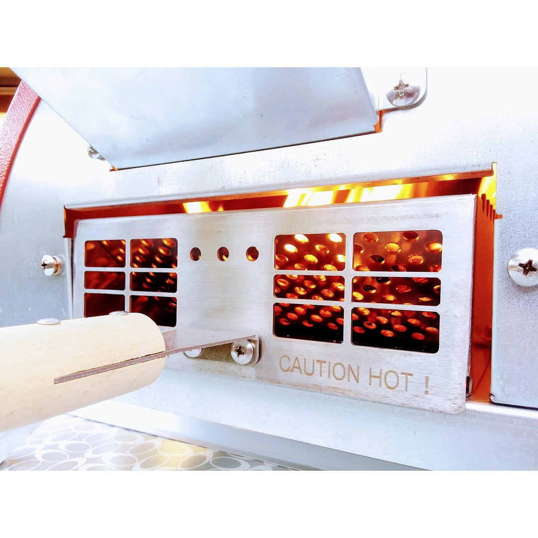Portable oven front with heat vents, open lid, and hot-surface warning panel